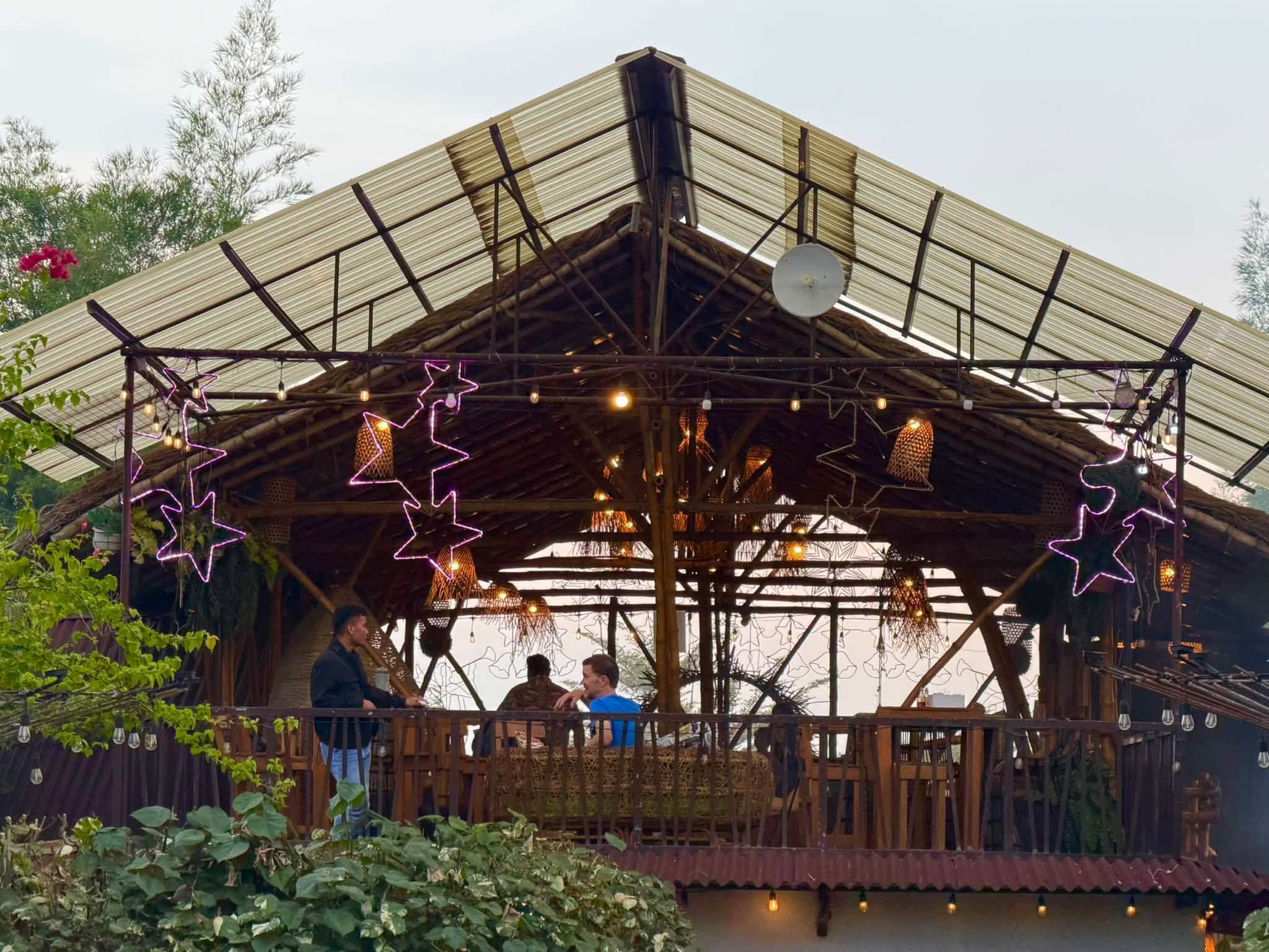 Visitors on the upper bamboo balcony at D’ Garden at Calatao