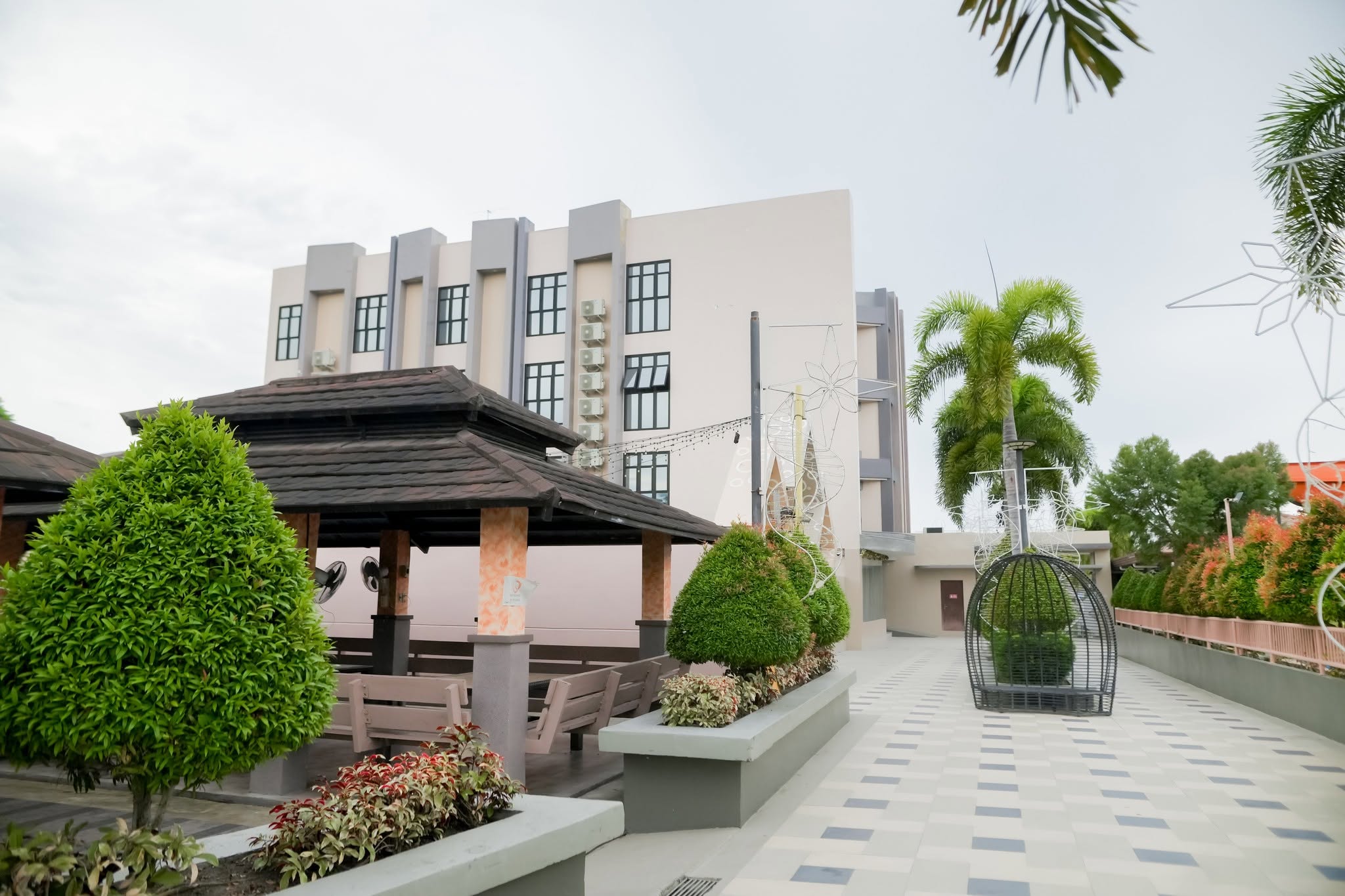 Landscaped resort grounds with gazebos and hotel building
