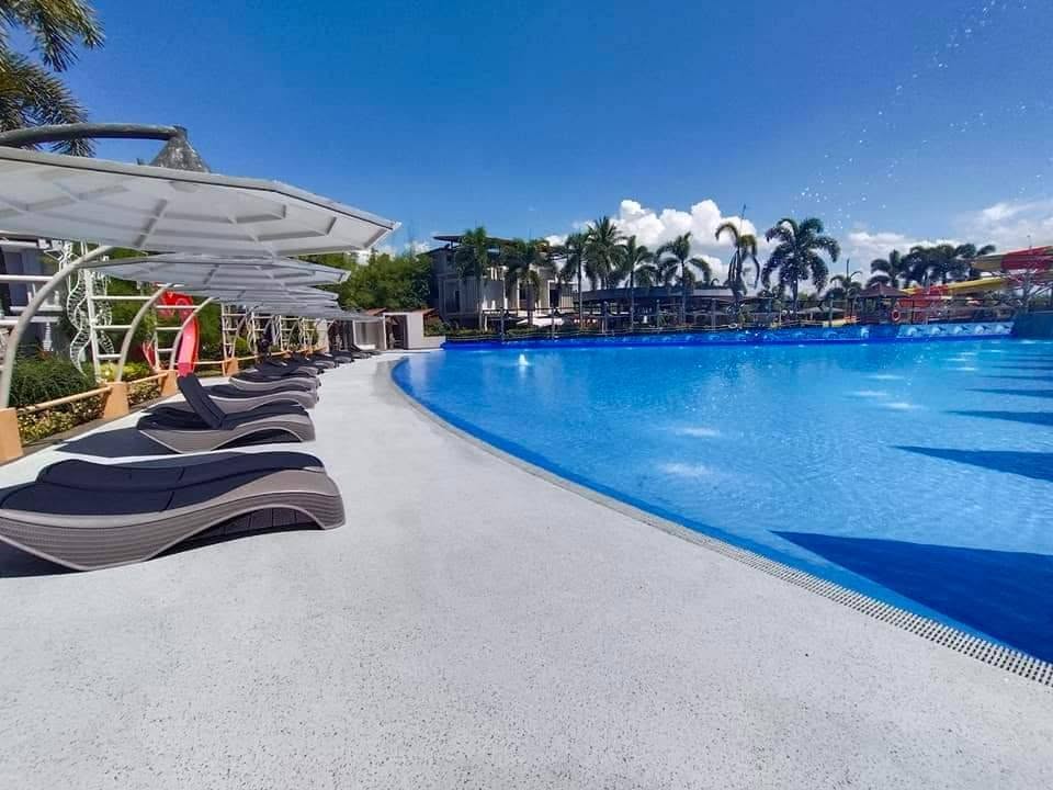 Poolside loungers beside the main wave pool