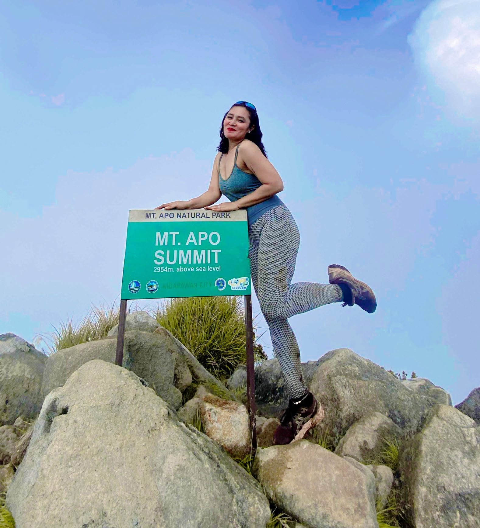 Irene Tan beside the Mt. Apo summit marker