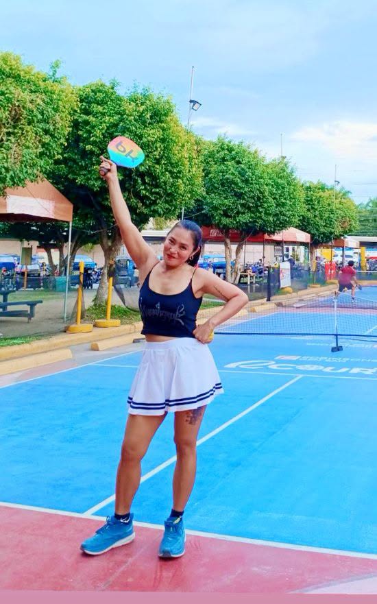 Irene Tan standing on an outdoor sports court