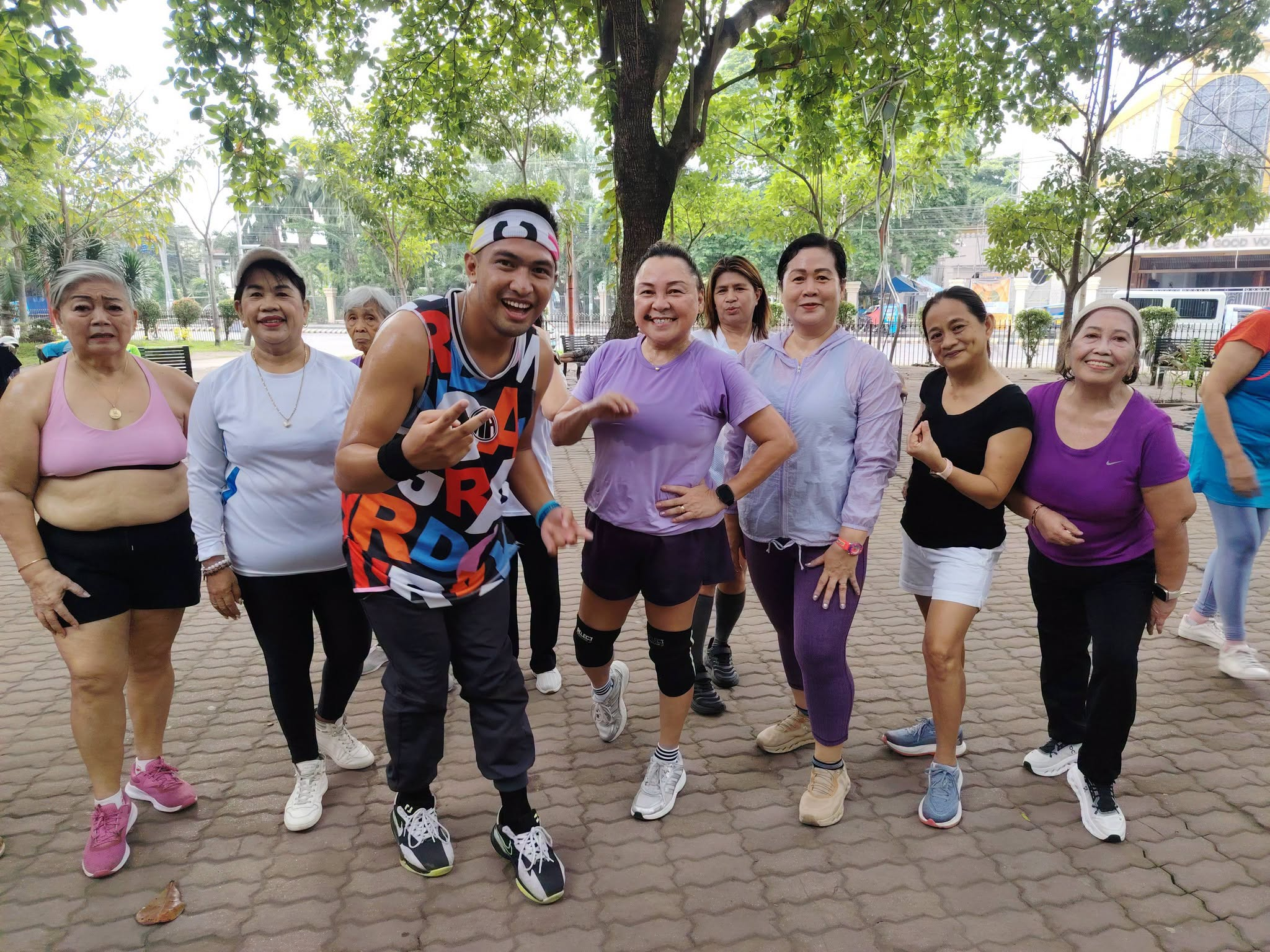 Fitness group smiling after exercise at Plaza Heneral Santos