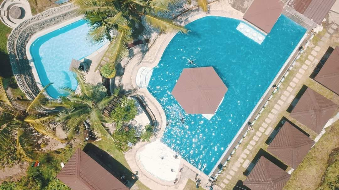Overhead view of the resort pools and poolside cottages