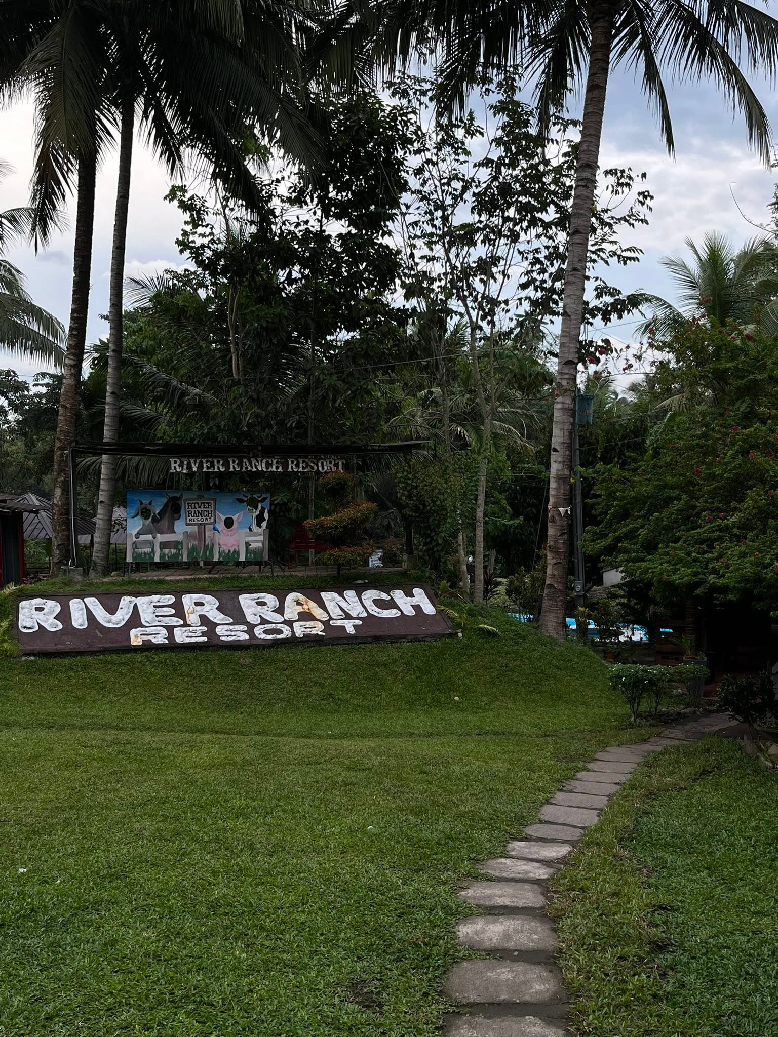 River Ranch Resort entrance sign beside a garden path