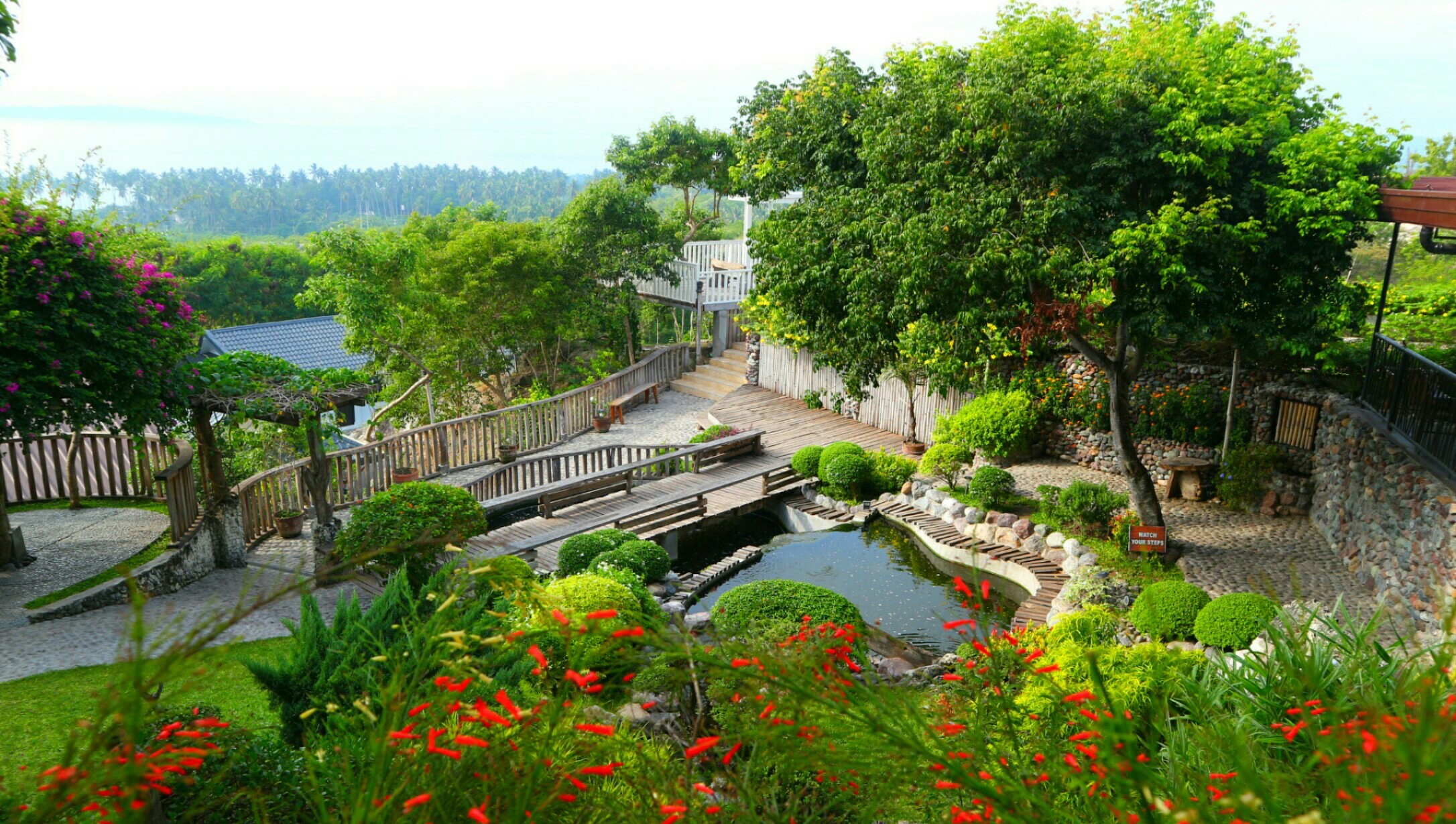 Landscaped garden walkways and pond at Sarangani Highlands Garden in General Santos City