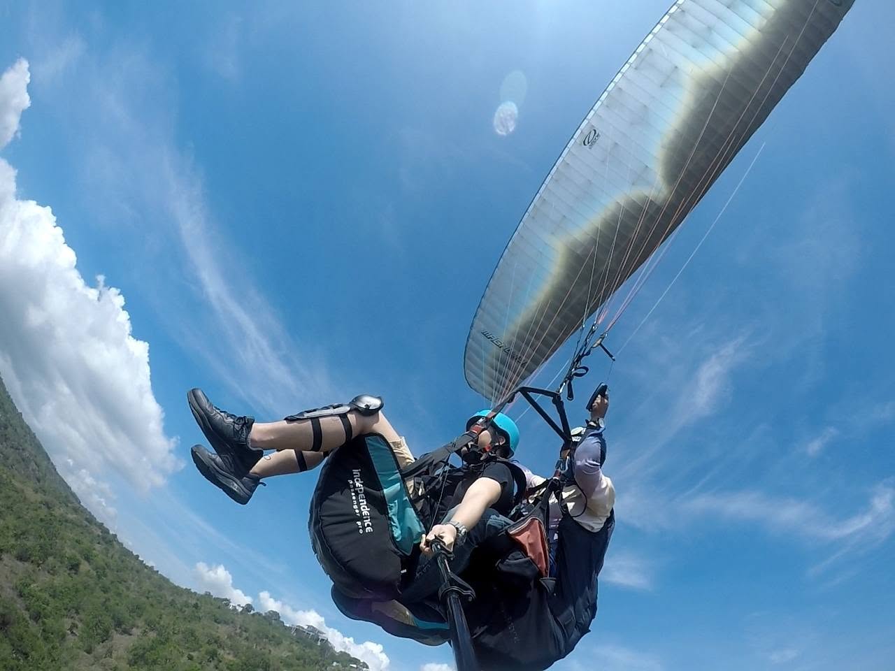 Tandem paragliding flight above the hills of Maasim