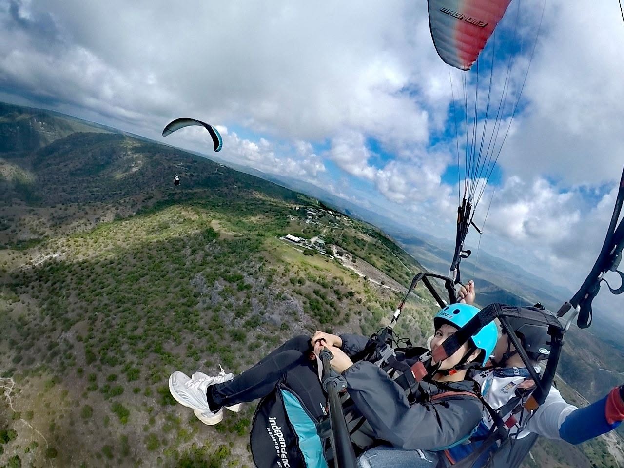Tandem paragliding selfie during a Soar High flight