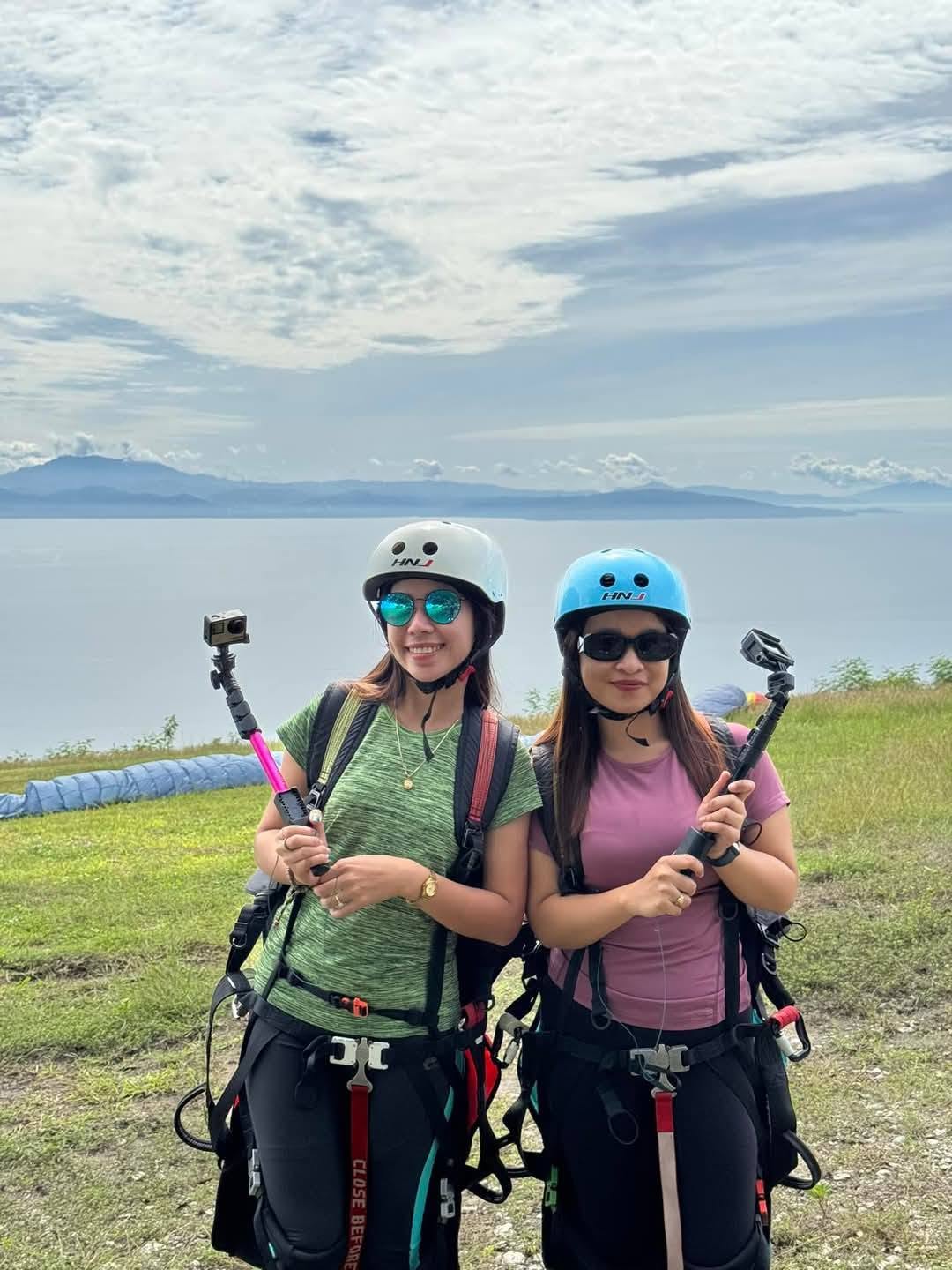 Paragliding guests with action cameras overlooking Sarangani Bay