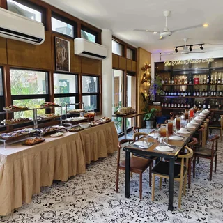Dining room arranged with buffet tables and long place settings